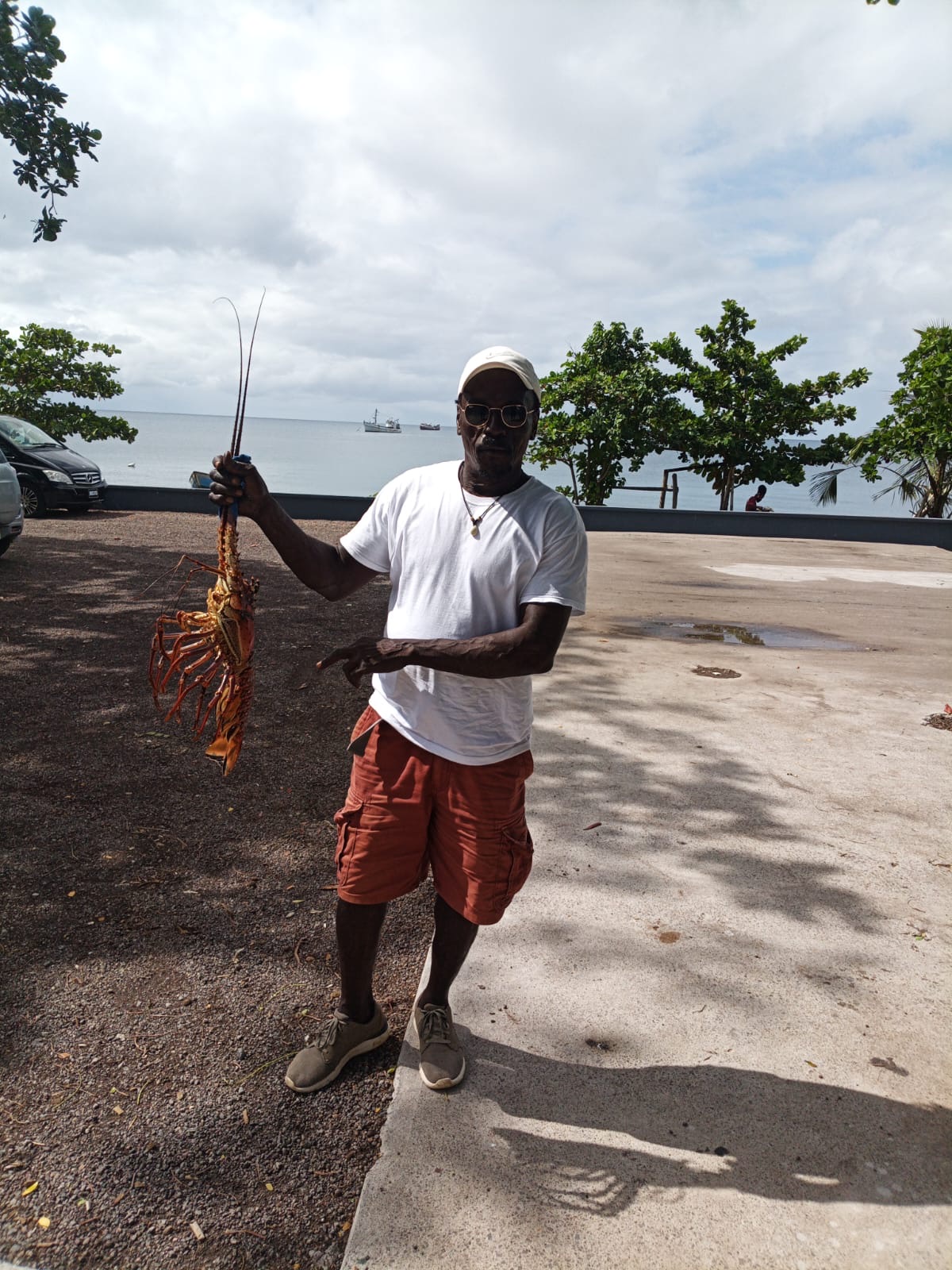 Roy holding a lionfish fresh from the Portsmouth coast